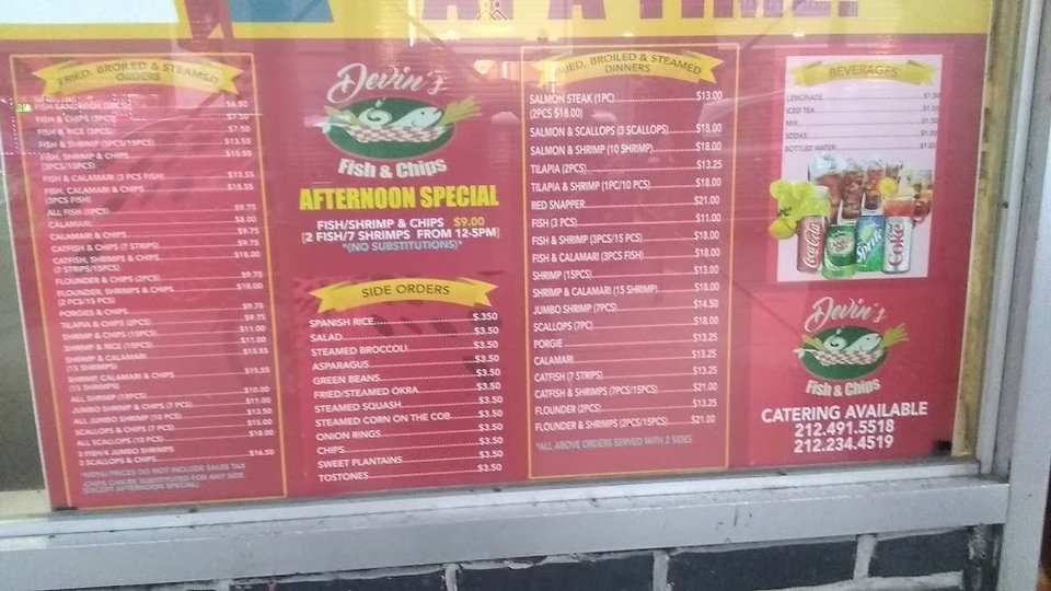 Menu board with seafood dinners and side orders.